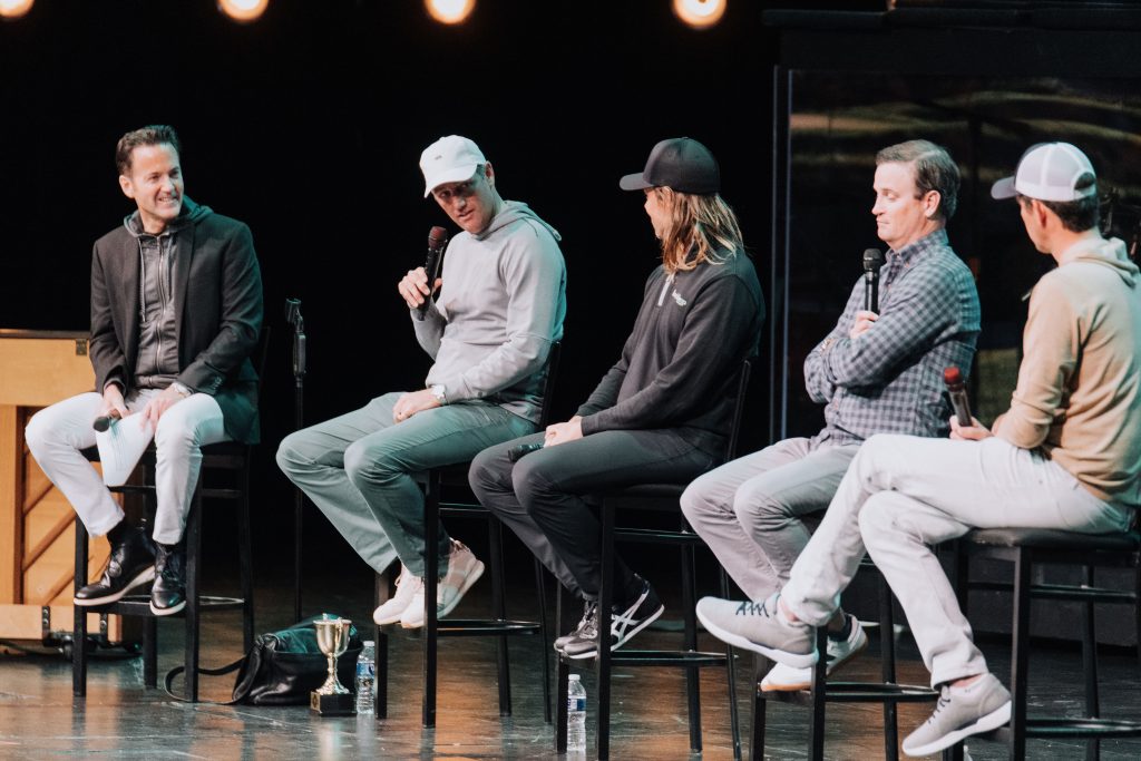Tales From The Tour. Brendan Todd, Aaron Baddeley, and Zach Johnson on stage.